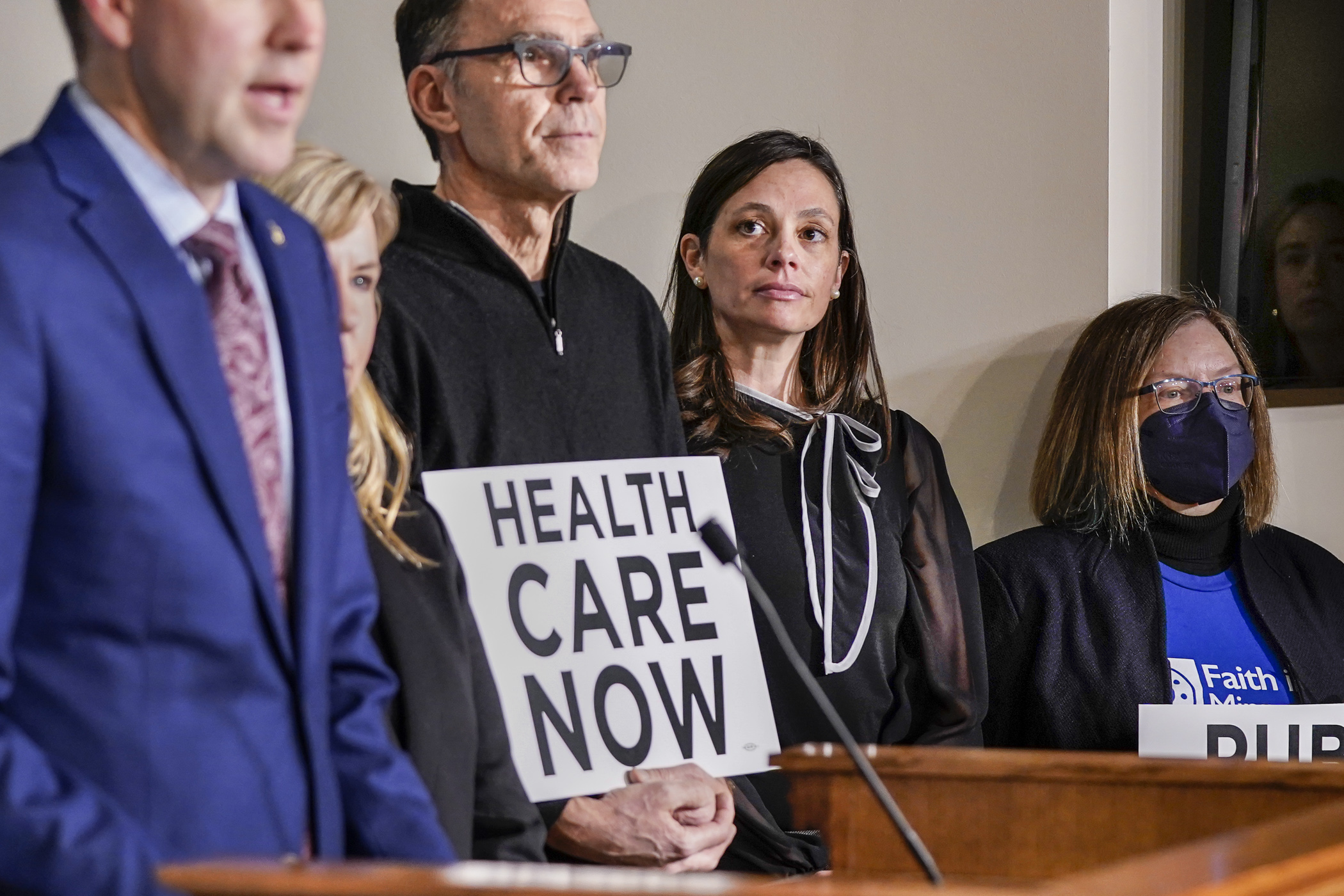 Rep. Kristi Pursell listens as House Majority Leader Jamie Long address the media Feb. 8 regarding HF96, a bill to create a public option for health insurance in Minnesota. (Photo by Catherine Davis)